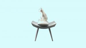 Foto karya Bunga Jeruk berjudul Frustated Feline. Sebuah patung kucing menoleh ke kiri di atas kursi.